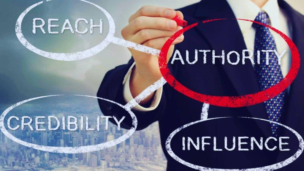 Businessman drawing connection between reach, authority, credibility and influence from referring domains